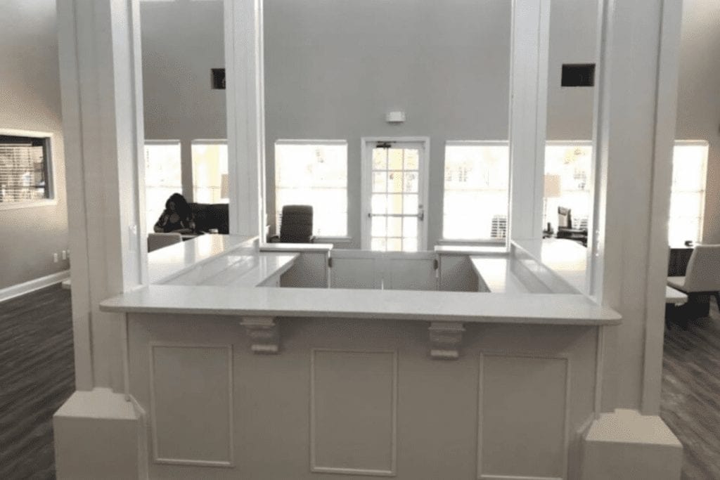 White reception desk with custom cabinetry by 1 Stop Cabinets