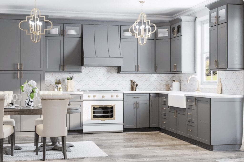 Gray shaker kitchen with gold accents and marble backsplash by 1 Stop Cabinets