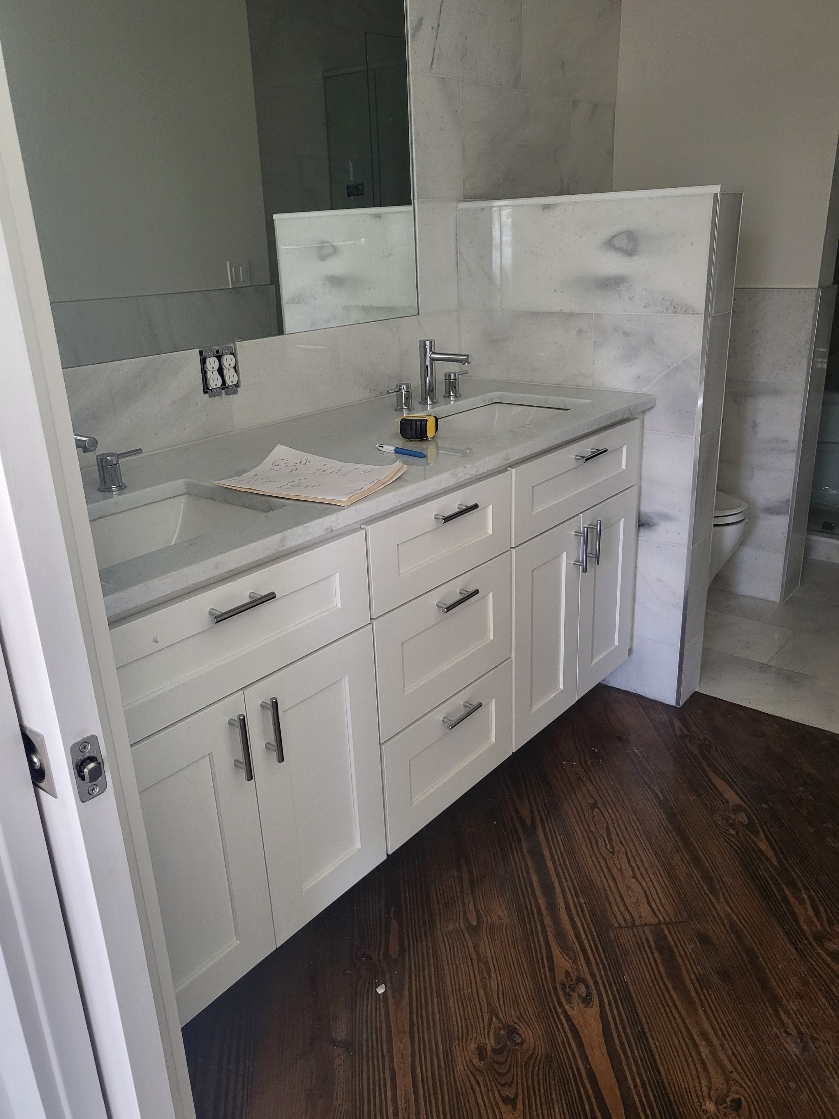 White bathroom vanity with marble countertop by 1 Stop Cabinets